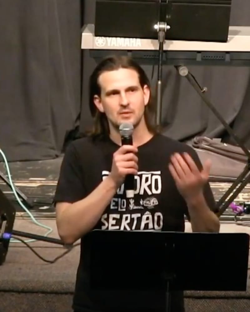 Josh Jordan speaking on stage